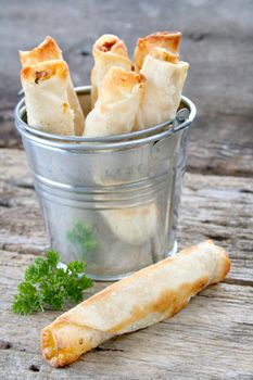 Chicken quesadilla's as an appetizer on a rustic looking background.