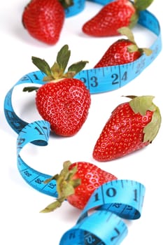 Healthy eating with fruit, strawberries. Berries with tape measure. health concept.