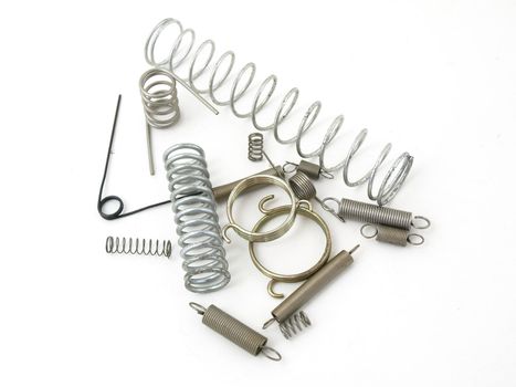 A set of miscellaneous wire springs isolated on a white background.