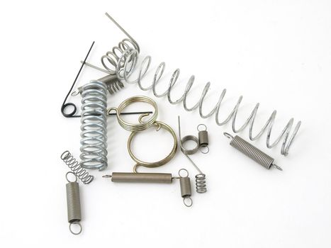 A set of miscellaneous wire springs isolated on a white background.
