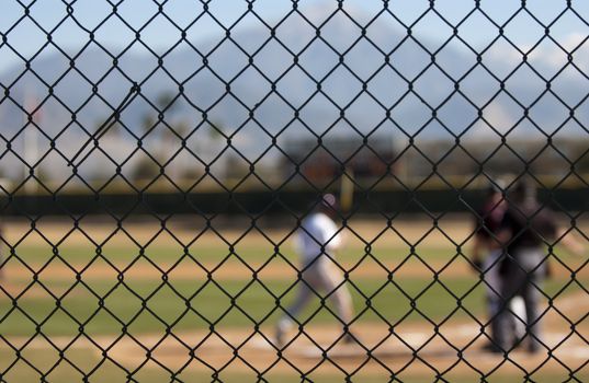 watching baseball through fence