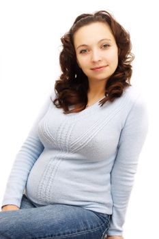 Smiling pregnant woman in blue over white