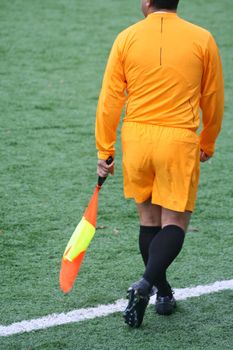 A soccer linesman during a game