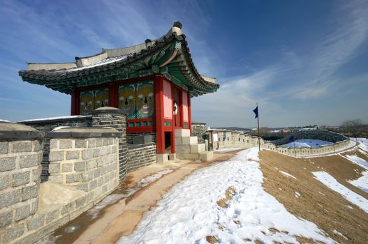 A watch tower on Hwaseong Fortress in the snow. Hwaseong is a UNESCO World Heritage site. Suwon, South Korea. 
