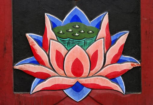 A close-up of a lotus flower painted on a Buddhist temple door. Busan, South Korea.

