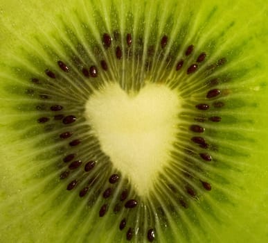 The juicy fruit cut - green kiwi forming a heart