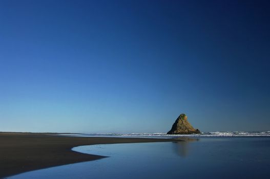 A wide angle view of Karekare, a West Coast Beach near Auckland, New Zealand.