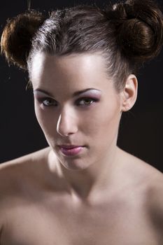 Beautiful young girl with fashionable hair and pink lipstick