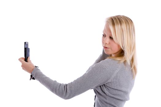 Cute young girl taking a photo of herself with her mobile phone