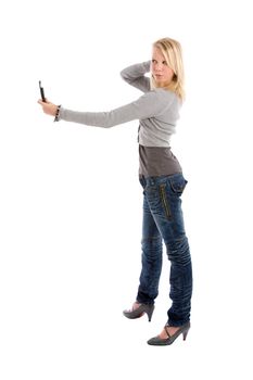 Cute young girl taking a photo of herself with her mobile phone