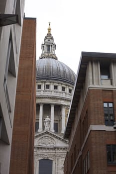 A view of St.Pauls Cathedral in London through city office blocks. Located on the millenium bridge.