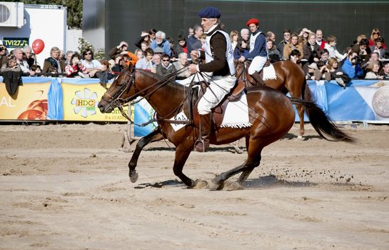 Argentina, Buenos Aires, July 27, 2010: One of the riders showed their skills in horse race classification in the Argentine Polo 124th exhibition of livestock rural Argentina in the track of the Sociedad Rural Argentina.