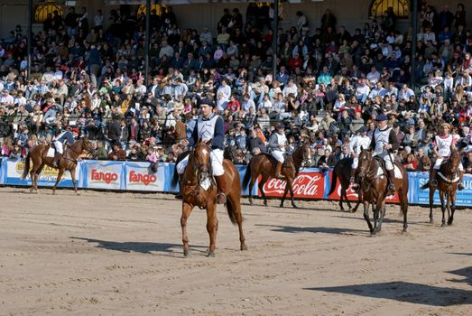 Argentina, Buenos Aires, July 27, 2010: Participants put their horses to the jury and the public in the classification of race Polo Argentino in the 124 th exhibition Rural Livestock and Argentina on the track of the Sociedad Rural Argentina in Buenos Aires 