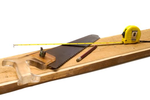 Tools on a board it is isolated on a white background.