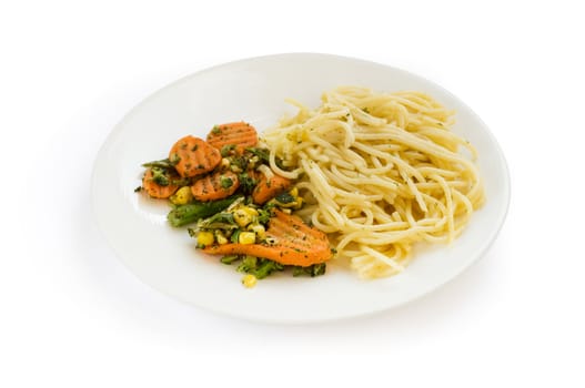 White plate with spagheti and cooked vegetables.