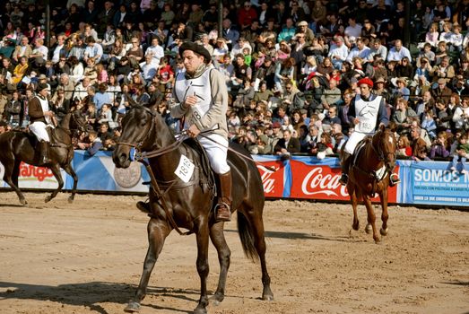 Argentina, Buenos Aires, July 27, 2010: Participants put their horses to the jury and the public in the classification of race Polo Argentino in the 124 th exhibition Rural Livestock and Argentina on the track of the Sociedad Rural Argentina in Buenos Aires 