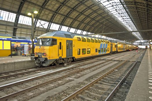 Train arriving in central station in Amsterdam the Netherlands