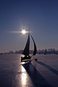 Traditional dutch: Ice sailing on a cold winterday on the Gouwzee in the Netherlands