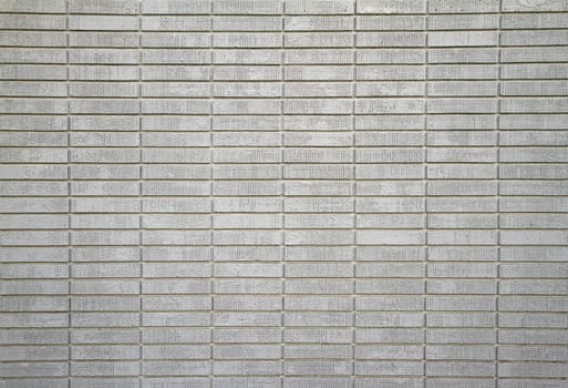 Large wall of white painted bricks taken from distance