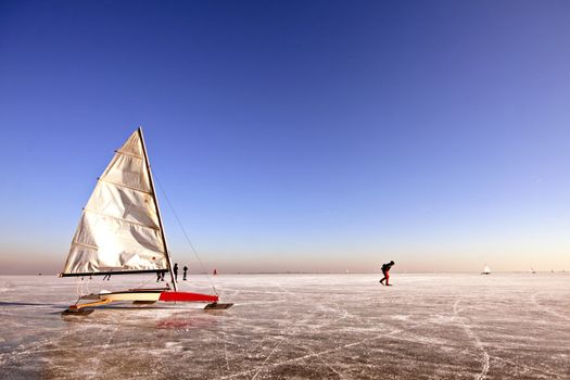 Traditional dutch: Ice sailing on a cold winterday on the Gouwzee in the Netherlands