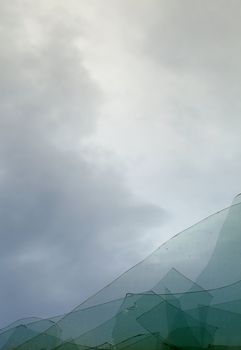 The cloudy sky through the broken window