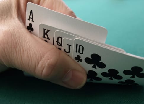 An ace high club straight hand in poker