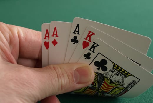 looking at a good poker hand with aces and kings