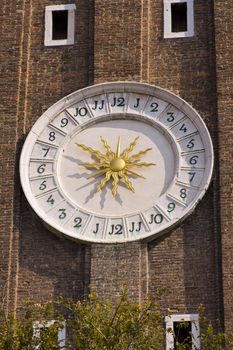 Detail of clockface on the clock tower on Santi Apostoli church in Venice Italy