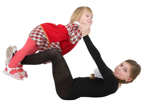 Two little acrobat girls on the white background