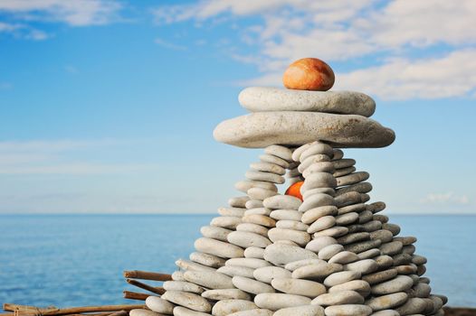 Pyramid from a sea pebble with the big stones with top