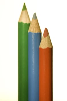 Three toy pens in different colors