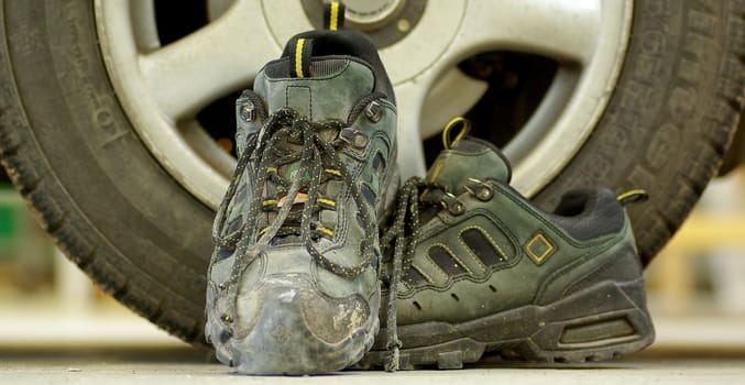 A pair of well used steel toed shoes