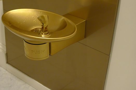 Golden water fountain quite elegant