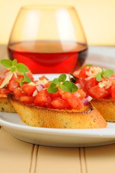 Delicious fresh homemade bruschetta on small toasts.