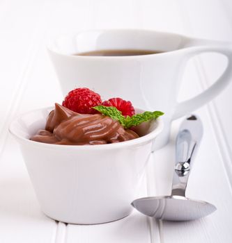 Creamy chocolate pudding with fresh rasberries and mint.