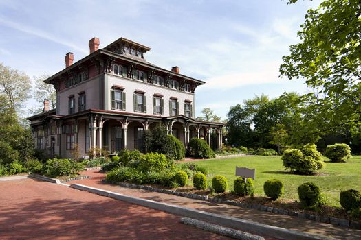 The Southern Mansion in Cape May, NJ, built with historic Victorian architecture, with garden yard.