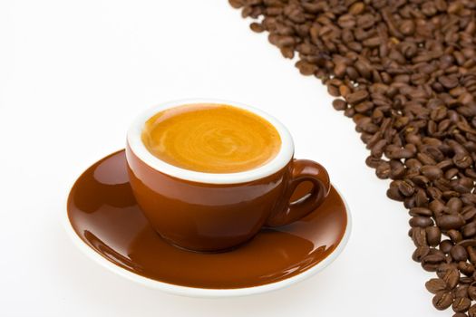 espresso cup and coffee beans on white background