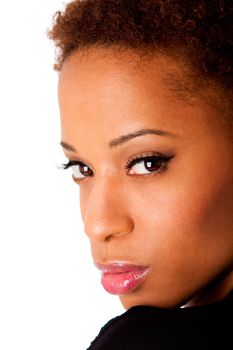 Face of beautiful African American woman with natural makeup and perfectly smooth skin, looking over her shoulder, isolated.