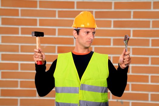 Portrait of a worker,over brick wall