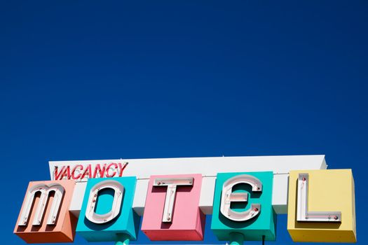 Multi-colored neon Motel and vacany sign in a 1950s style