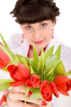 Girl with bouquet of tulips on isolated white