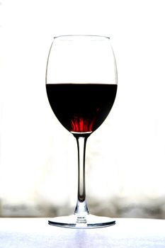 glass of wine over white grey background