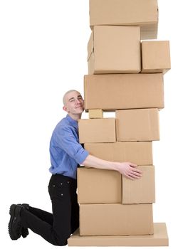 Man embrace pile from cardboard boxes on white