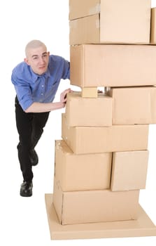 Man pushing heap from cardboard boxes on white