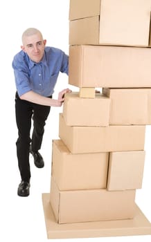 Man pushing heap from cardboard boxes on white