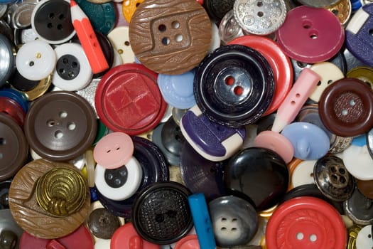 Multicolored plastic button background photographing close-up