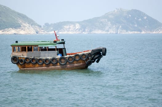 Small boat waiting in Hongkong harbour, at East Lamma Channel, near Lamma Island.
