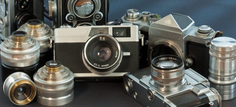 antique cameras on black background