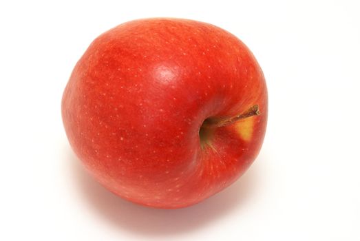 One red apple laying on it's side.