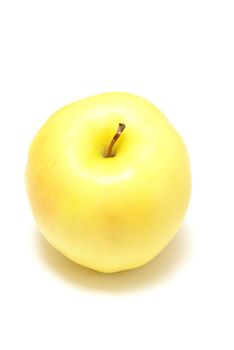 One yellow apple isolated on white background.
